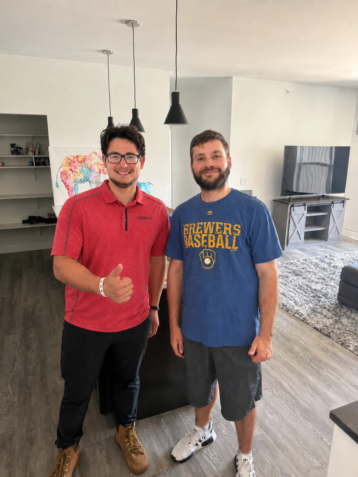 Jacob from Box Life Moving with a happy customer in his new Madison home