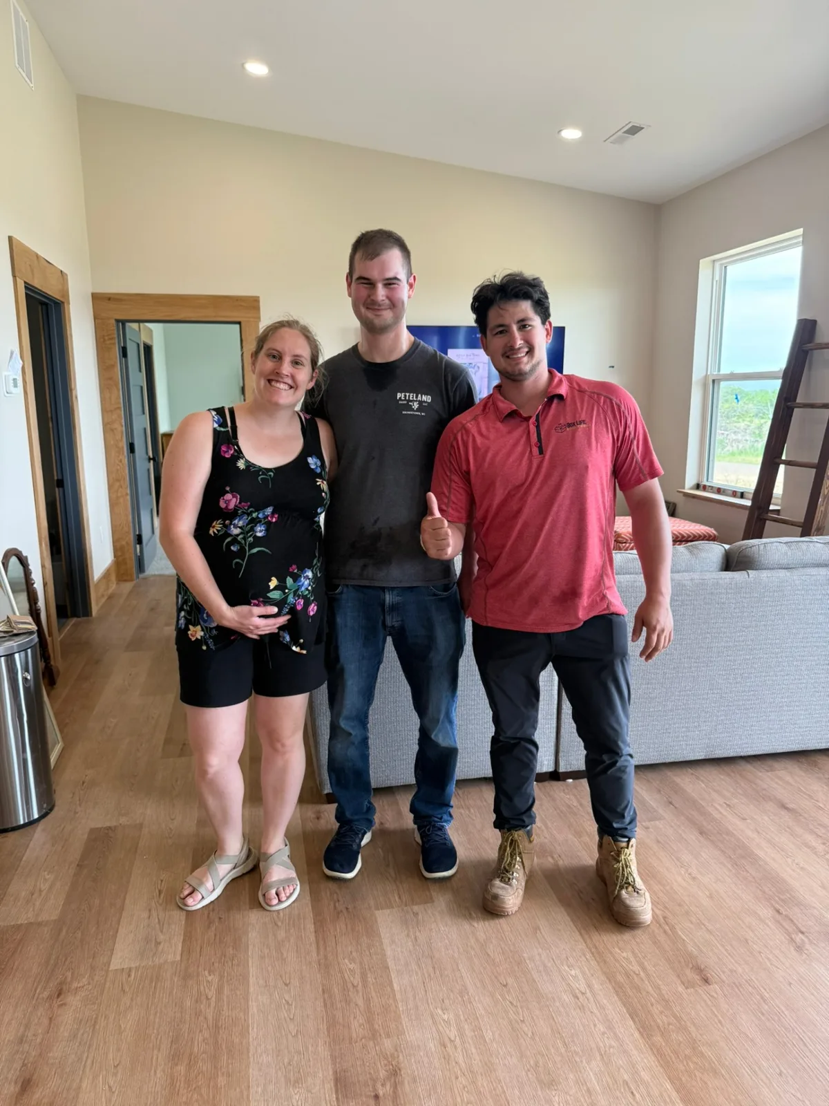 Box Life Moving crew member with happy customers in their new Madison-area home