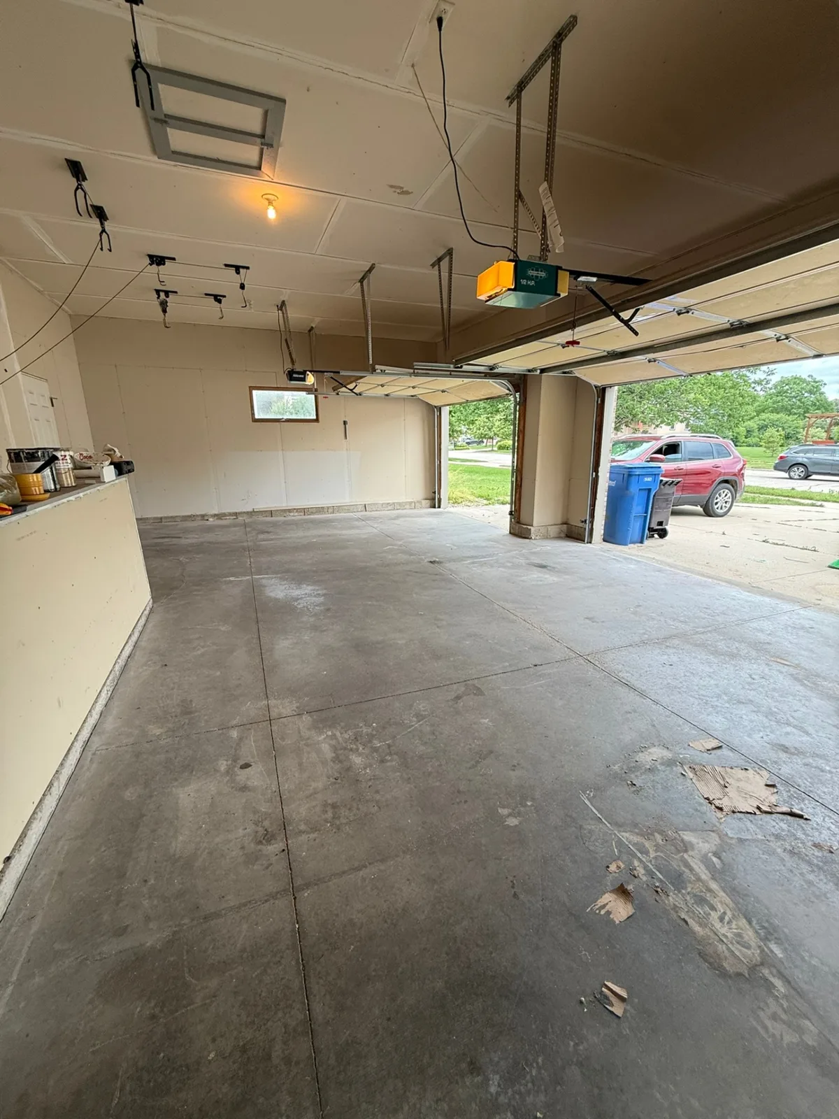 After: same Madison-area garage completely cleared and swept clean by the Box Life Moving junk removal crew