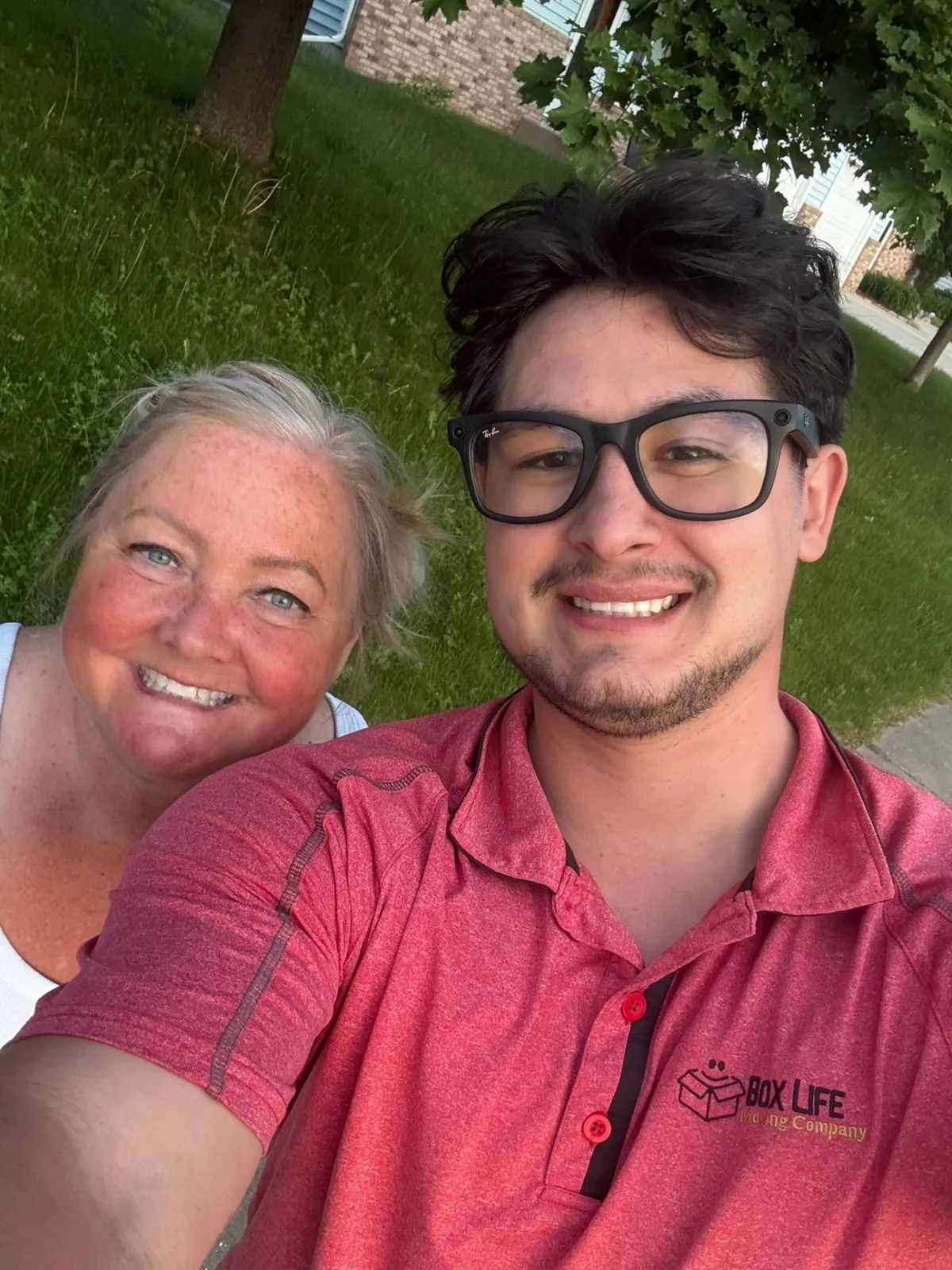 Jacob from Box Life Moving with a happy customer after a successful move in the Madison area